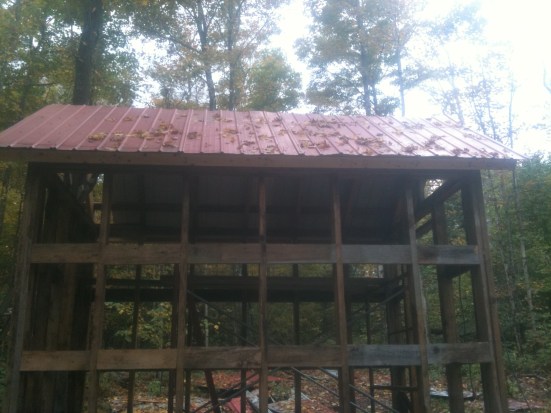 I put wood scrap blocking in between all of the wall studs so I'd have nailing for the rough cut 1 by I used for siding.  It was also leftovers from my uncles barn project.
